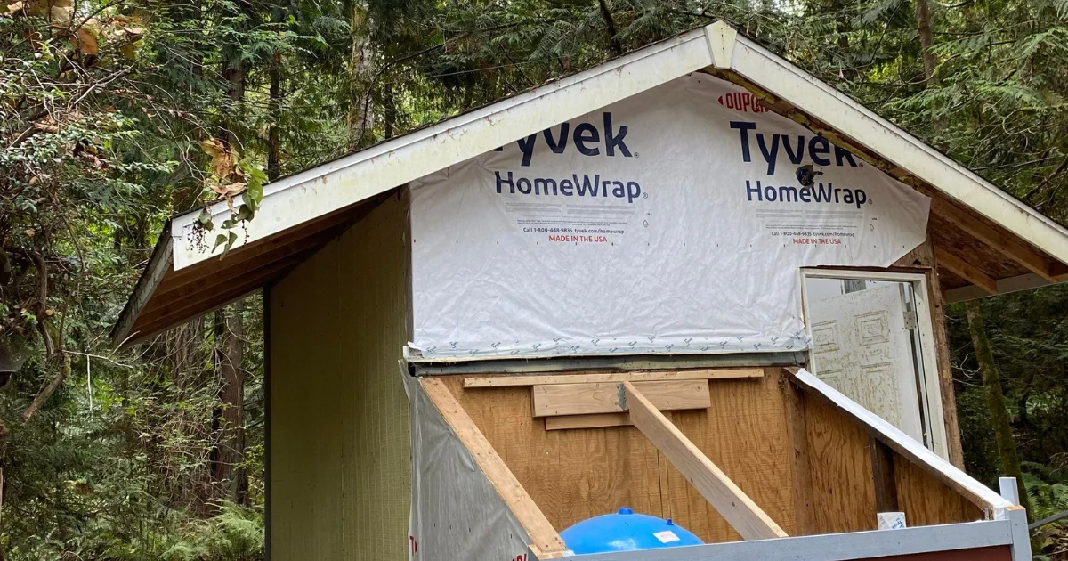 New siding being installed, weather barrier protection